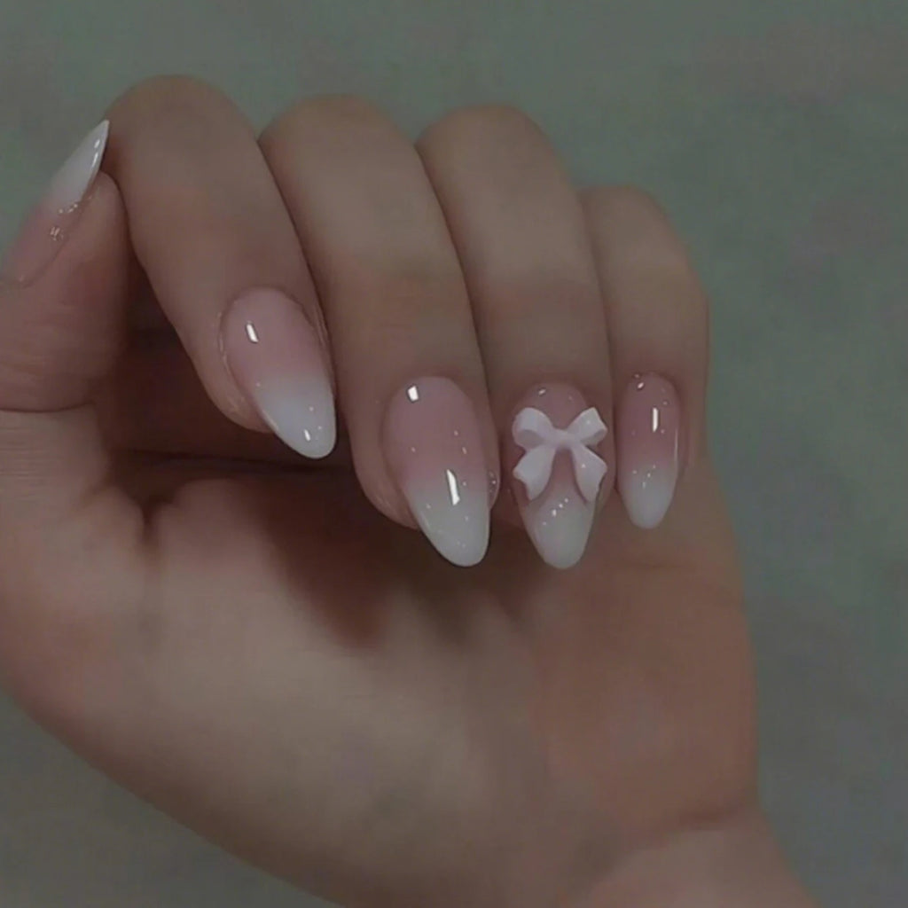 24 piezas de uñas postizas almendradas de tamaño mediano con diseños de lazo rosa, uñas acrílicas brillantes para pegar, ideales para mujeres y niñas.