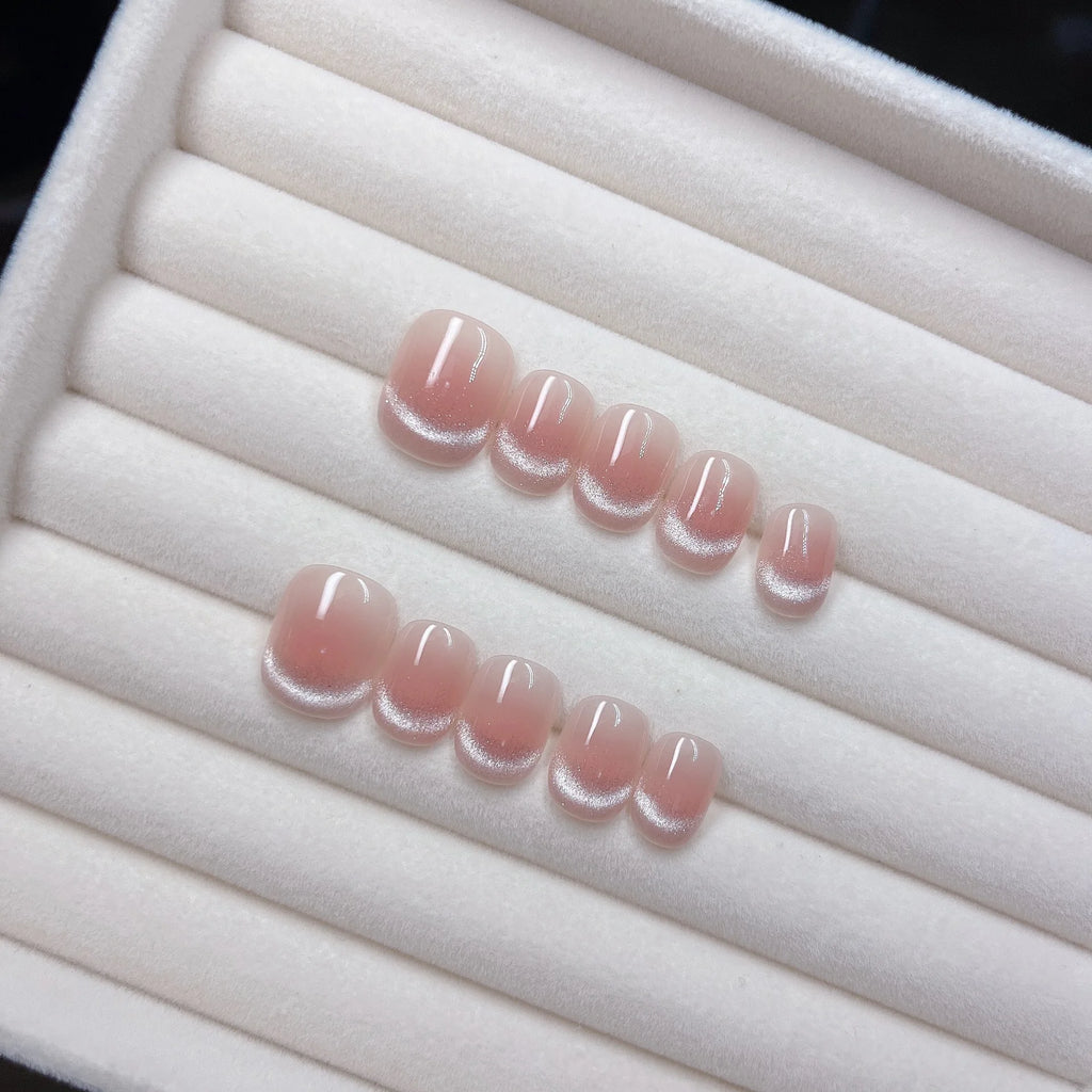 10 piezas de uñas postizas hechas a mano (estilo *press-on*) de longitud media; diseño francés con borde rosa escalonado y efecto ojo de gato brillante; cobertura total para mujeres y chicas.