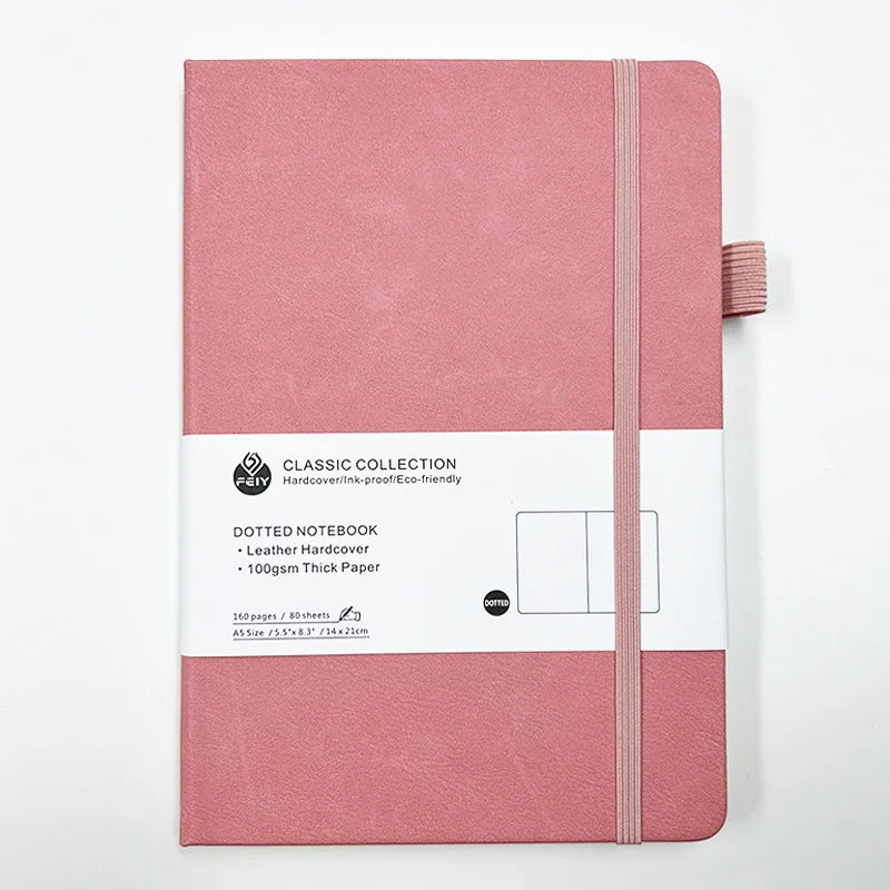 Cuaderno A5 con estampado de puntos y cierre de banda elástica; ideal para oficina, negocios o uso estudiantil; diseño elegante y atractivo.