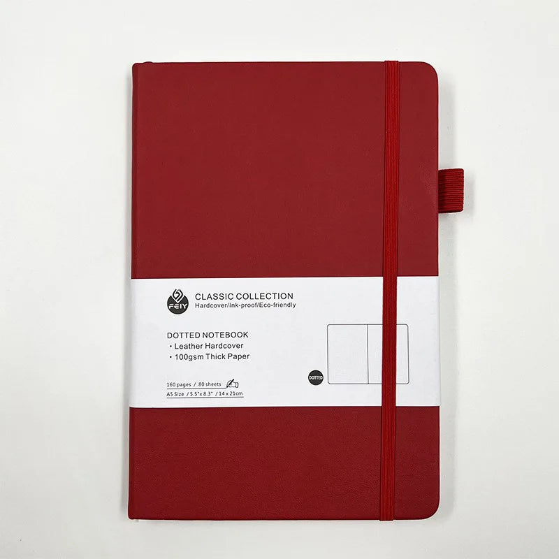 Cuaderno A5 con estampado de puntos y cierre de banda elástica; ideal para oficina, negocios o uso estudiantil; diseño elegante y atractivo.