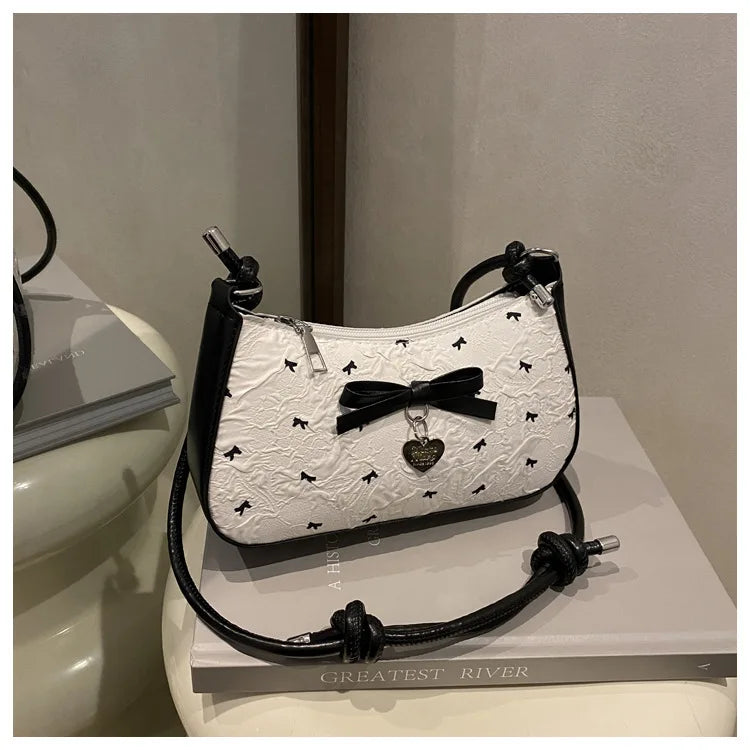 Bolso de hombro pequeño y cuadrado estilo Y2K , con diseño de lazo rosa, un accesorio versátil y moderno.