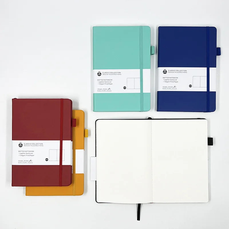 Cuaderno A5 con estampado de puntos y cierre de banda elástica; ideal para oficina, negocios o uso estudiantil; diseño elegante y atractivo.