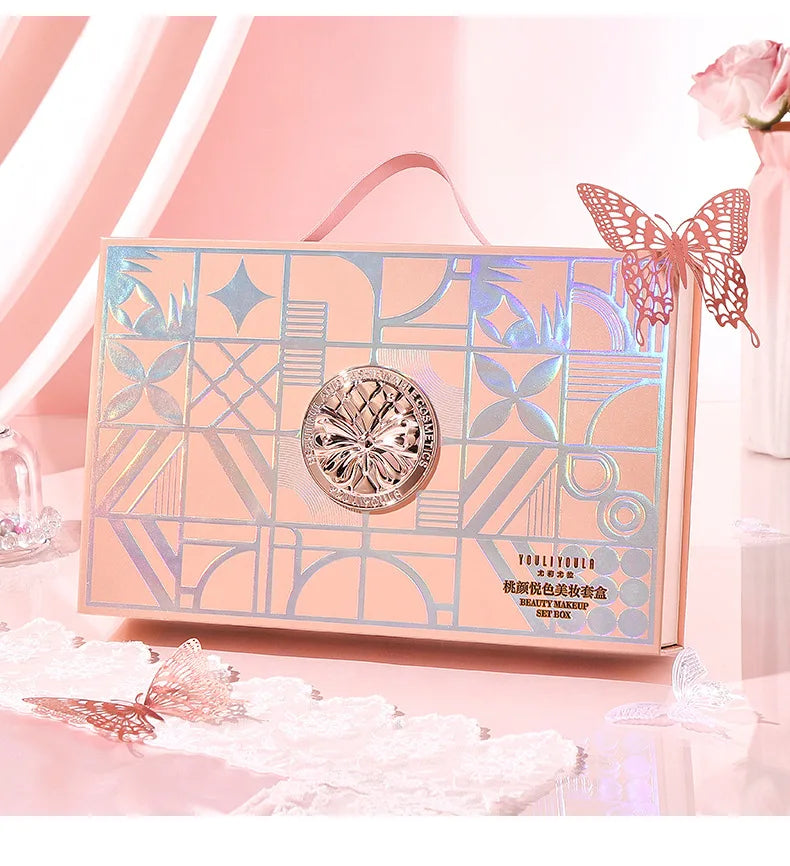 Set de maquillaje completo: labial, sombra de ojos, lápiz de cejas, BB cream tipo *cushion* y máscara de pestañas (9 piezas en caja de regalo).