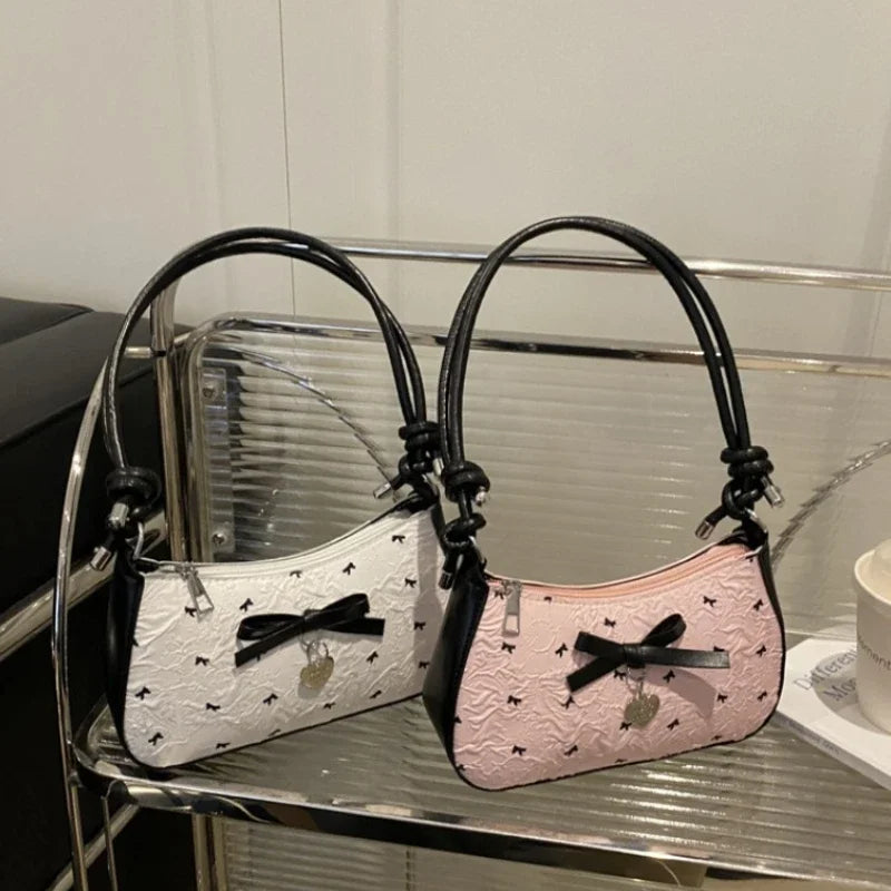 Bolso de hombro pequeño y cuadrado estilo Y2K , con diseño de lazo rosa, un accesorio versátil y moderno.